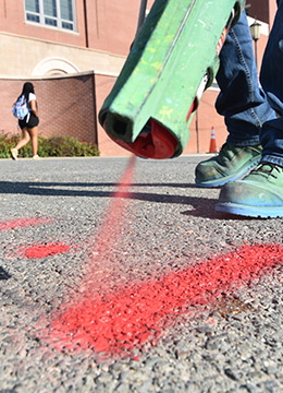 Engineer marking spot for utility locating