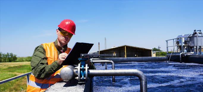 engineer inspecting waste water facility