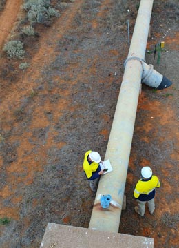 engineers inspecting utility pipeline