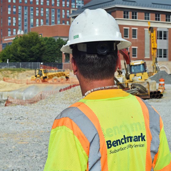 Benchmark operator working in location of underground utilities