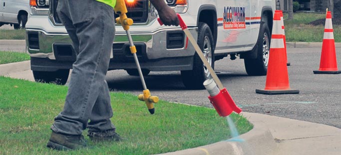 Engineer marking spot for utility locating