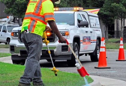 Engineer marking drilling spot for utility locating