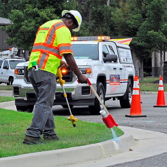 Engineer marking drilling spot for utility locating