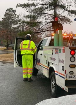 Worker arriving at site for subsurface utility designation and mapping